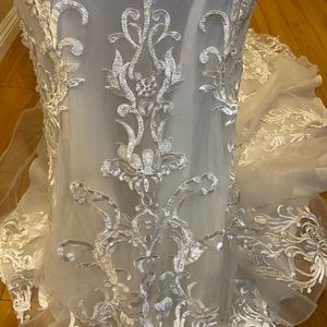 Hand beaded custom made wedding dress. Bought in 2019.